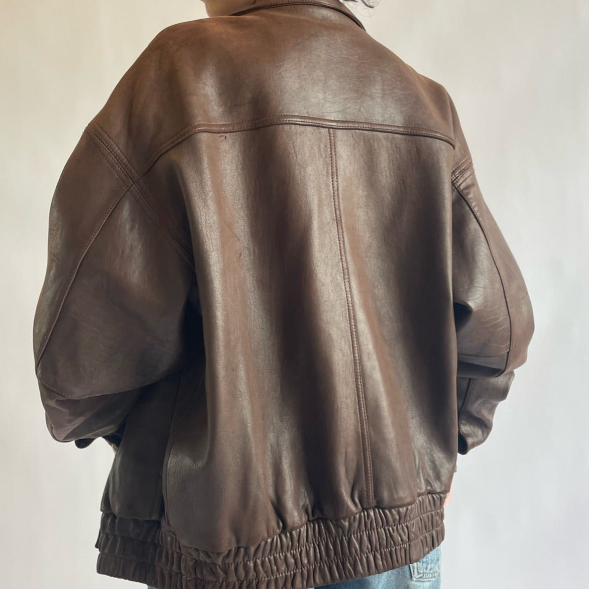 brown bomber jacket