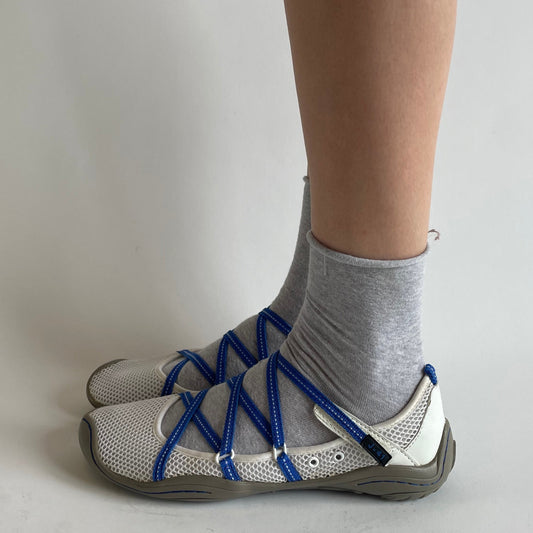 white and blue sporty flats