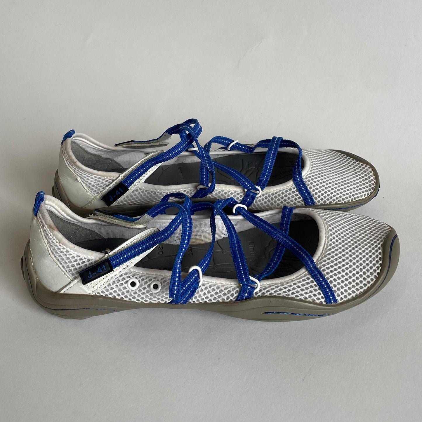 white and blue sporty flats
