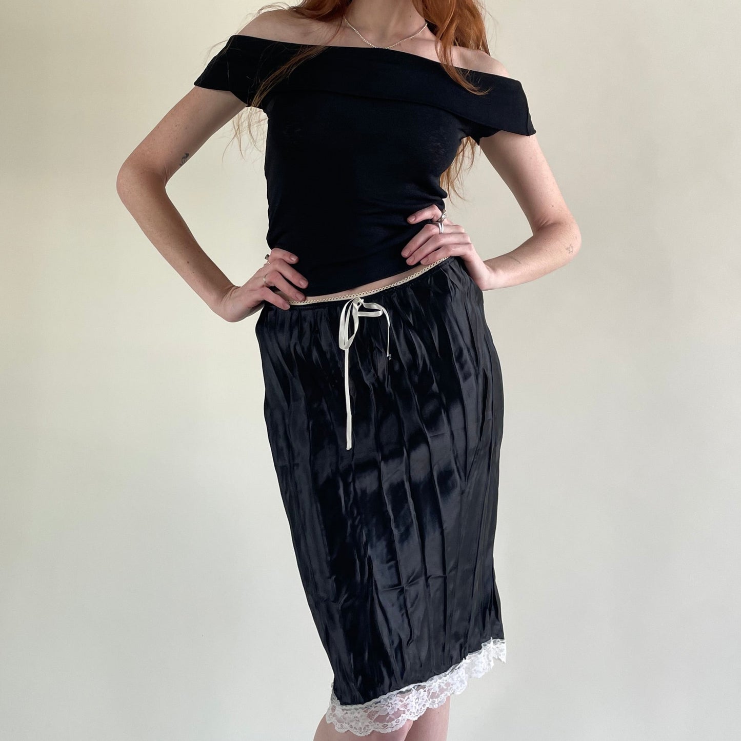 black pleated skirt